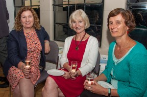 Some of Bright Red's language authors holding drinks and chatting