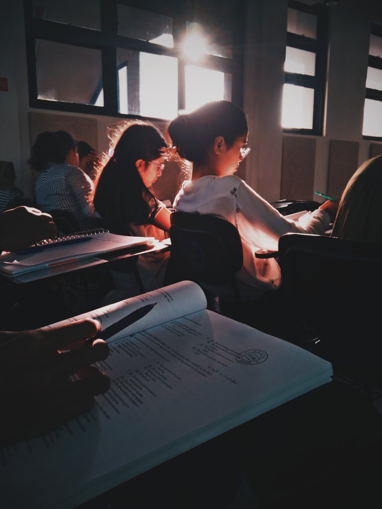 Female students studying in a classroom setting