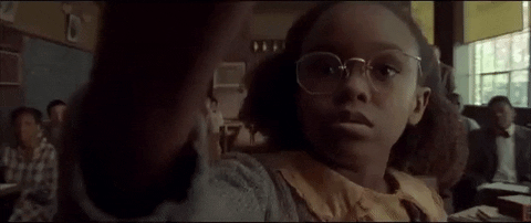 Girl writing on blackboard